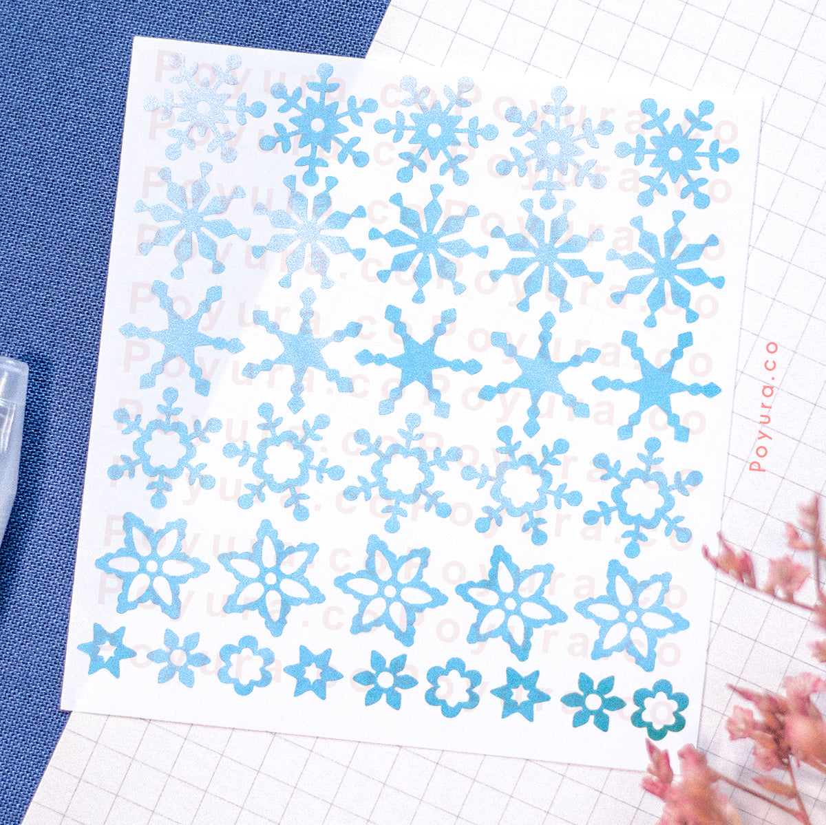 Borderless sticker with snow flake cutouts in different blue tints