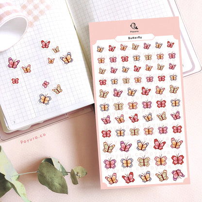 Stickers of cute spring butterfly in different colors on a journal