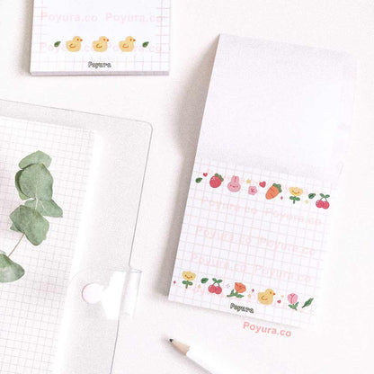 White square memo notepad with grid and cute garden friends doodles