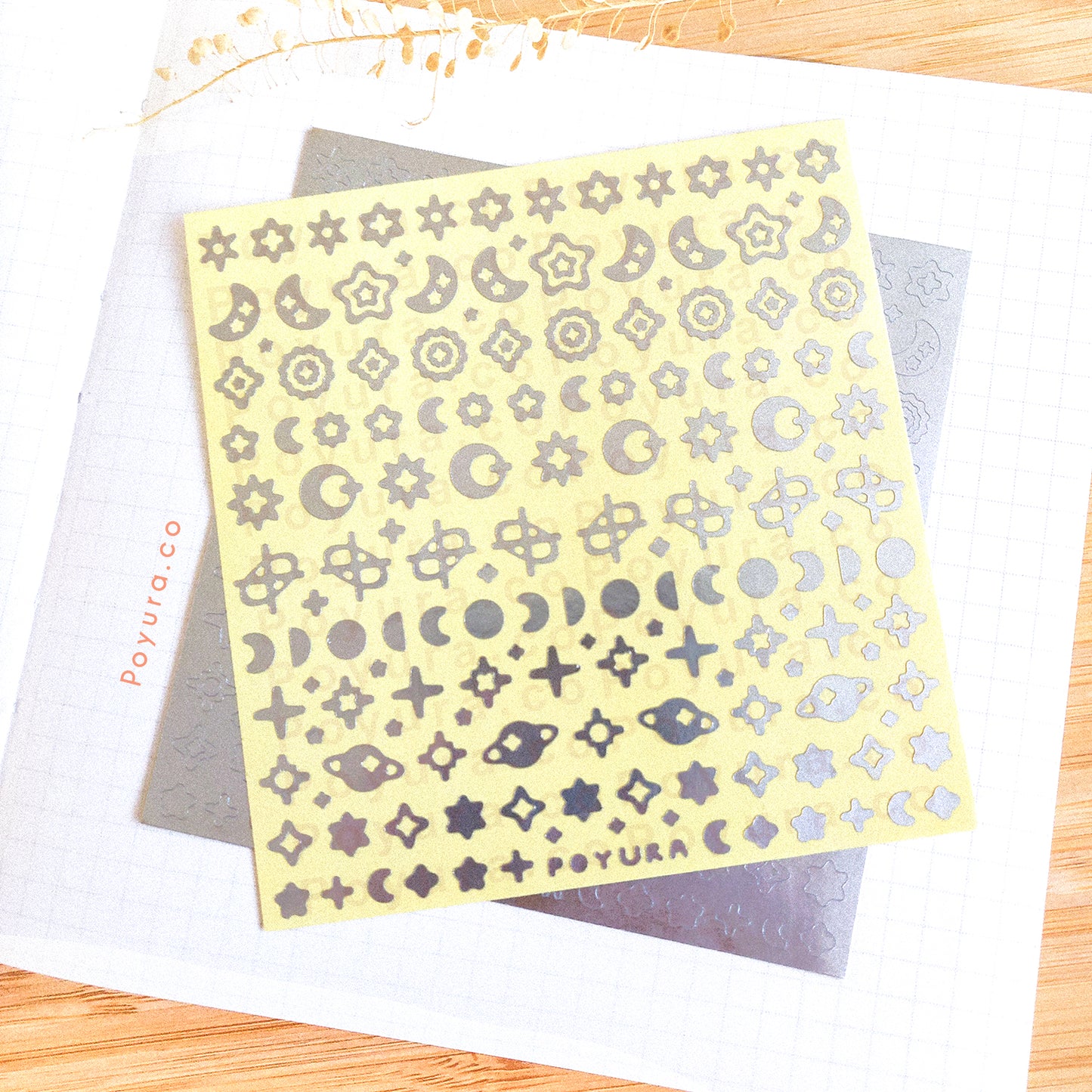 Borderless sticker with the sun and moon cutouts in silver foil