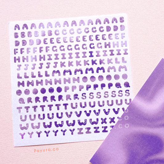 Borderless sticker with uppercase alphabet letter cutouts in different purple tints