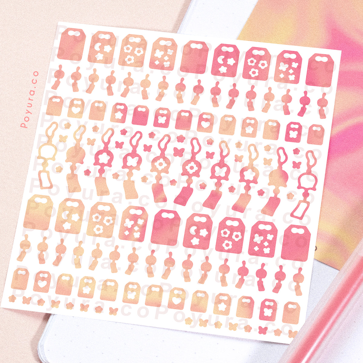 Borderless sticker with windchime and omamori cutouts in different pink tints