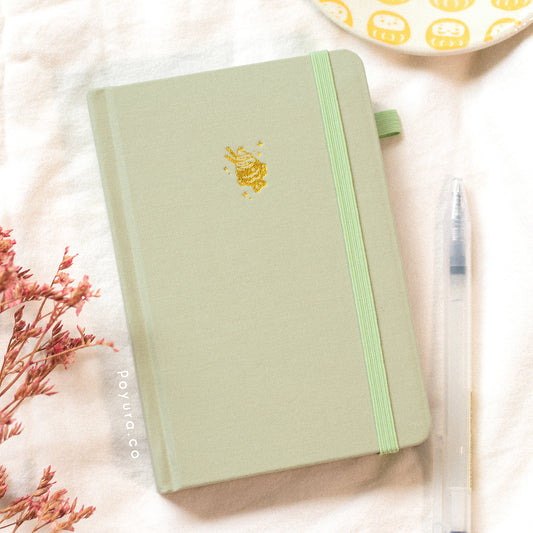 A look inside the Matcha Taiyaki A6 Bullet Journal with gold foil and dotted paper