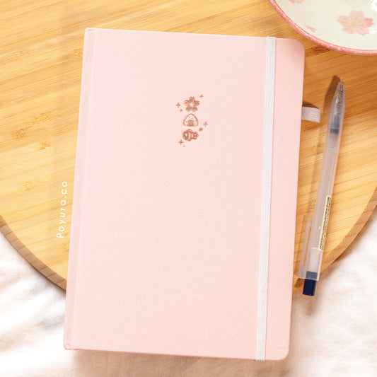 A look inside the Sakura Dango A5 Bullet Journal with rose gold foil and dotted paper